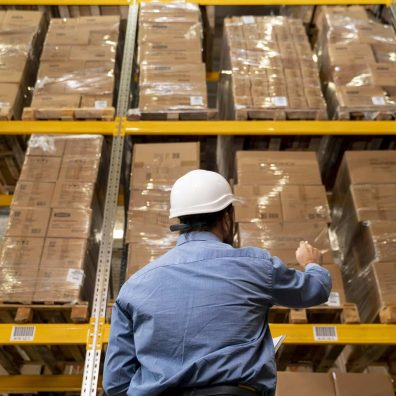 man-with-helmet-working-in-warehouse